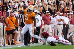 Oct 15, 2022; Knoxville, Tennessee, USA; Tennessee Volunteers quarterback Hendon Hooker (5) is forced out of bounds by Alabama Crimson Tide defensive back Terrion Arnold (3) Credit: Randy Sartin-USA TODAY Sports