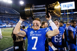 Nov 26, 2022; Lexington, Kentucky, USA; Kentucky Wildcats quarterback Will Levis (7) holds up the Governor   s Cup trophy after winning the game against the Louisville Cardinals at Kroger Field. Mandatory Credit: Jordan Prather-USA TODAY Sports