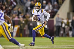 Nov 26, 2022; College Station, Texas, USA; LSU Tigers quarterback Jayden Daniels (5) in action during the game between the Texas A&M Aggies and the LSU Tigers at Kyle Field. Mandatory Credit: Jerome Miron-USA TODAY Sports