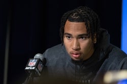 Mar 3, 2023; Indianapolis, IN, USA; Ohio State quarterback C.J. Stroud (QB12) speaks to the press at the NFL Combine at Lucas Oil Stadium. Mandatory Credit: Trevor Ruszkowski-USA TODAY Sports