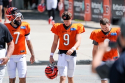 Cincinnati Bengals quarterbacks Reid Sinnett (7) Joe Burrow (9) and Jake Browning (6) enter the Kettering Health Bengals Practice Fields outside of Paycor Stadium Wednesday, August 30, 2023. Burrow suffered a calf injury on July 27, has not participated in practice publicly, but did go through his normal pregame warmup before the Bengals preseason opener against the Green Bay Packers on Aug. 11.