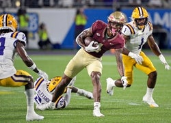 Sep 3, 2023; Orlando, Florida, USA; Florida State Seminoles wide receiver Keon Coleman (4) runs the ball for a touchdown during the first half against the Louisiana State Tigers at Camping World Stadium. Mandatory Credit: Melina Myers-USA TODAY Sports