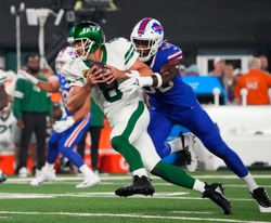 Sep 11, 2023; East Rutherford, New Jersey, USA; Buffalo Bills defensive end Leonard Floyd (56) sacks New York Jets quarterback Aaron Rodgers (8) during the first quarter at MetLife Stadium. Rogers left the game with an injury after the play. Mandatory Credit: Robert Deutsch-USA TODAY Sports