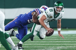 Sep 11, 2023; East Rutherford, New Jersey, USA; New York Jets quarterback Aaron Rodgers (8) is injured while being sacked by Buffalo Bills defensive end Leonard Floyd (56) during the first half at MetLife Stadium. Mandatory Credit: Vincent Carchietta-USA TODAY Sports