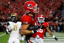 Georgia tight end Brock Bowers (19) drives in for a touchdown during the first half of a NCAA college football game against UAB in Athens, Ga., on Saturday, Sept. 23, 2023.