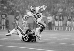Jan 24, 1982; Detroit, MI, USA; FILE PHOTO; San Francisco 49ers quarterback (16) Joe Montana eludes Cincinnati Bengals defensive back (13) Ken Riley during Super Bowl XVI at the Silverdome. The 49ers defeated the Bengals to earn their first Super Bowl title 26-21.  Mandatory Credit: David Boss-USA TODAY Sports Copyright   David Boss