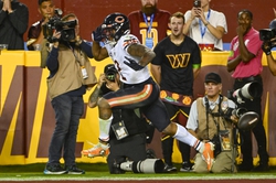 Oct 5, 2023; Landover, Maryland, USA; Chicago Bears wide receiver DJ Moore (2) reacts after a touchdown against the Washington Commanders during the first half at FedExField. Mandatory Credit: Brad Mills-USA TODAY Sports