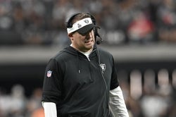 Oct 15, 2023; Paradise, Nevada, USA; Las Vegas Raiders head coach Josh McDaniels looks down field against the New England Patriots in the fourth quarter at Allegiant Stadium. Mandatory Credit: Candice Ward-USA TODAY Sports