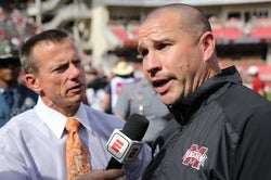 Oct 21, 2023; Fayetteville, Arkansas, USA; Mississippi State Bulldogs head coach Zach Arnett talks to an ESPN reporter after a game against the Arkansas Razorbacks at Donald W. Reynolds Razorback Stadium. Mississippi State won 7-3. Mandatory Credit: Nelson Chenault-USA TODAY Sports