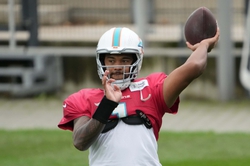 Nov 2, 2023; Frankfurt, Germany; Miami Dolphins quarterback Tua Tagovailoa (1) throws the ball during practice at the PSD Bank Arena. Mandatory Credit: Kirby Lee-USA TODAY Sports