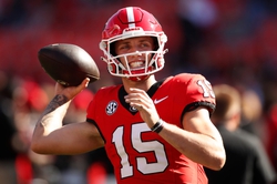 Georgia quarterback Carson Beck (15) warms up before the start of a NCAA college football game against Missouri in Athens, Ga., on Saturday, Nov. 4, 2023.