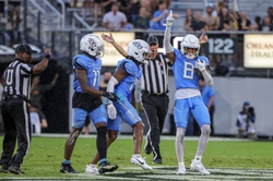 Nov 11, 2023; Orlando, Florida, USA; UCF Knights defensive back Demari Henderson (8) celebrates intercepting a Oklahoma State Cowboys pass during the second quarter at FBC Mortgage Stadium. Mandatory Credit: Mike Watters-USA TODAY Sports