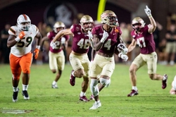 Seminoles wide receiver Keon Coleman sprints down the sideline in FSUs matchup with the Miami Hurricanes