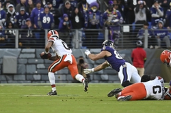 Nov 12, 2023; Baltimore, Maryland, USA; Cleveland Browns cornerback Greg Newsome II (0) returns a interception for a touchdown in the fourth quarter against the Baltimore Ravens at M&T Bank Stadium. Mandatory Credit: Tommy Gilligan-USA TODAY Sports