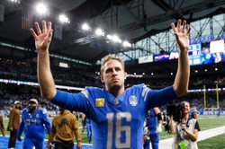 Detroit Lions quarterback Jared Goff waves to fans after the 31-26 comeback win over the Chicago Bears at Ford Field in Detroit on Sunday, Nov. 19, 2023.