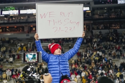 Nov 25, 2023; Atlanta, Georgia, USA; Andrew Smart son of Georgia Bulldogs head coach Kirby Smart (not shown) holds up a sign after Georgia defeated the Georgia Tech Yellow Jackets at Hyundai Field. Mandatory Credit: Dale Zanine-USA TODAY Sports