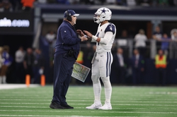 Dec 10, 2023; Arlington, Texas, USA; Dallas Cowboys head coach Mike McCarthy talks with quarterback Dak Prescott (4) during a timeout in the game against the Philadelphia Eagles at AT&T Stadium. Mandatory Credit: Tim Heitman-USA TODAY Sports