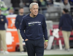 Pete Carroll watches his Seattle team warm up before playing against the Arizona Cardinals. The Seattle Times reported on 1/10/24 that Carroll is out as the Seahawks' head coach.