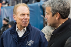 Dec 14, 2013; Philadelphia, PA, USA; Dec 14, 2013; Philadelphia, PA, USA; Heisman Trophy winner and Naval Academy alumnus Roger Staubach speaks with Army Black Knights athletic director Boo Coorigan on the sidelines prior to the start of the 114th Army-Navy game at Lincoln Financial Field. Navy Midshipmen defeated Army Black Knights 34-7. Mandatory Credit: Tommy Gilligan-USA TODAY Sports